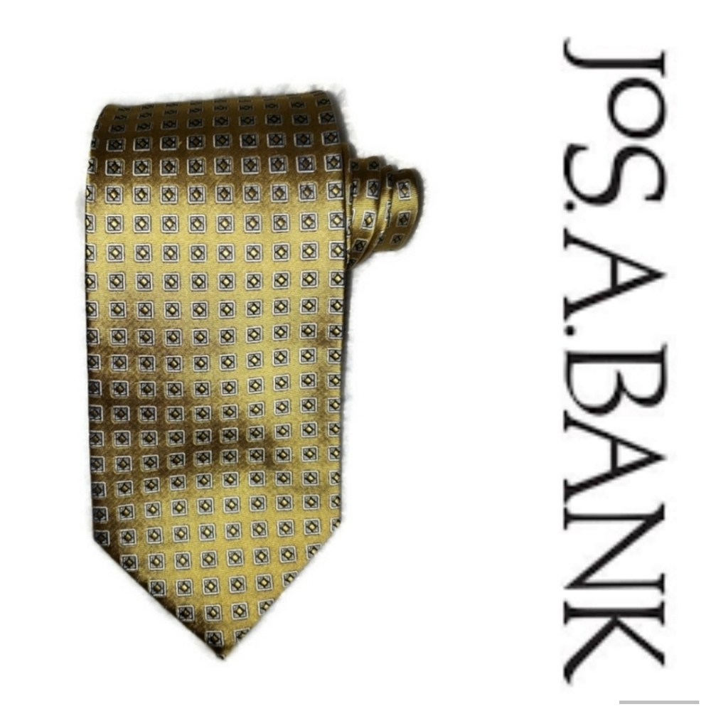 Jos. A. Banks Men's tie in gold with a repeated white squares patterns